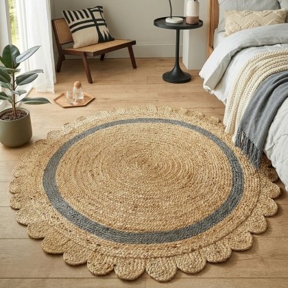 Scalloped round jute rug with grey trim